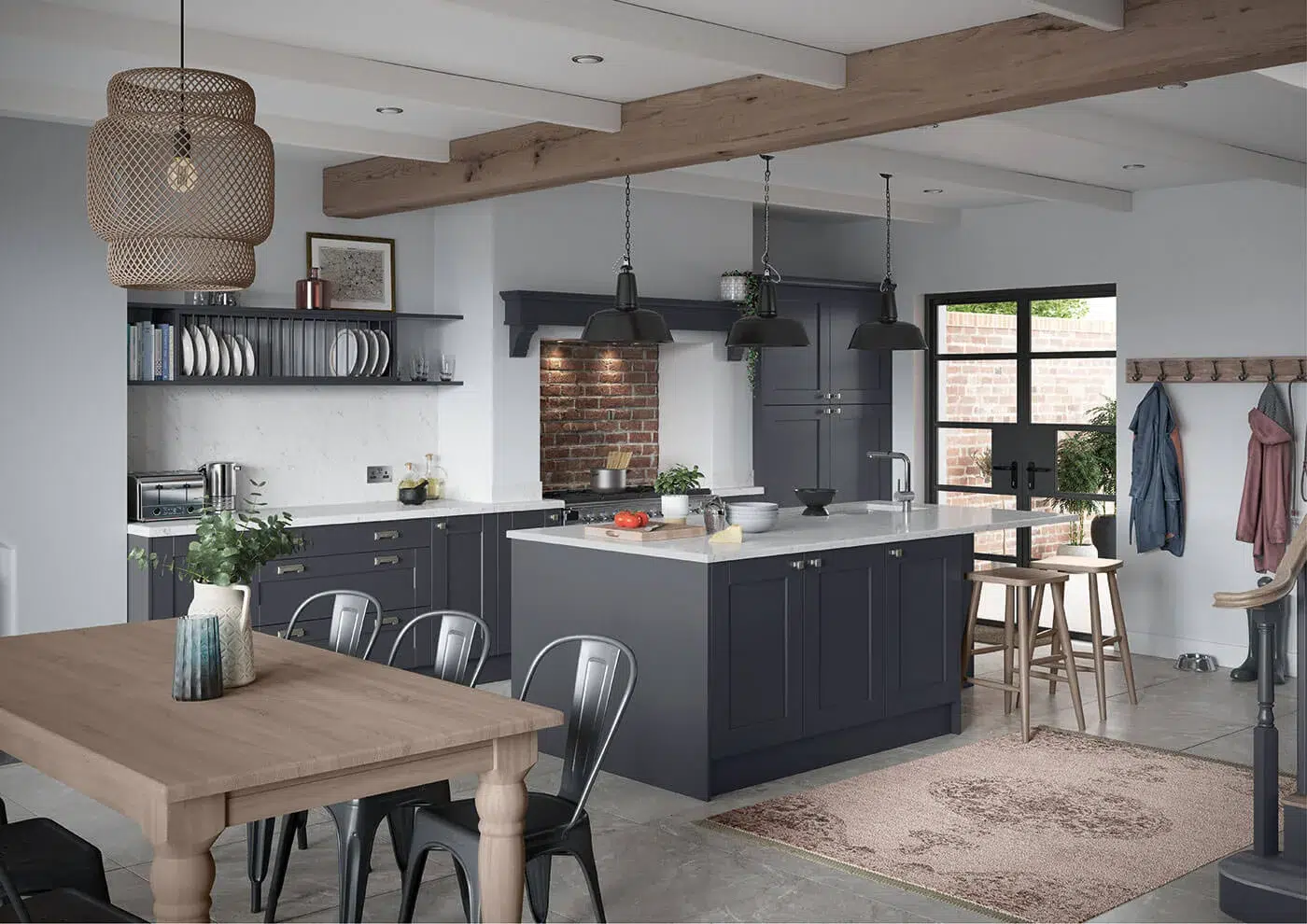 Navy shaker fitted kitchen with brass handles in a bright family home